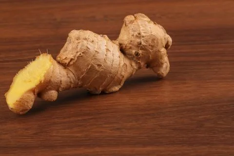 The Ginger root on the wood Stock Photos
