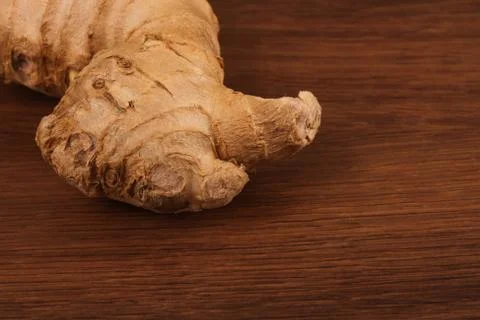 The Ginger root on the wood Stock Photos