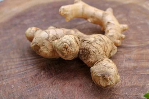 Ginger root  on wooden background Stock Photos