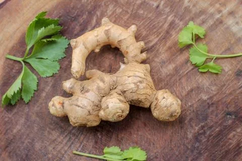Ginger root  on wooden background Stock Photos
