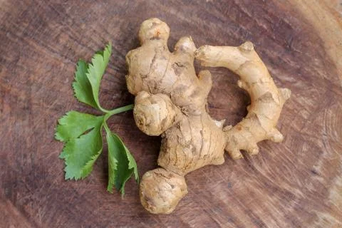 Ginger root  on wooden background Stock Photos