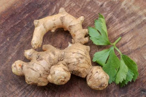 Ginger root  on wooden background Stock Photos