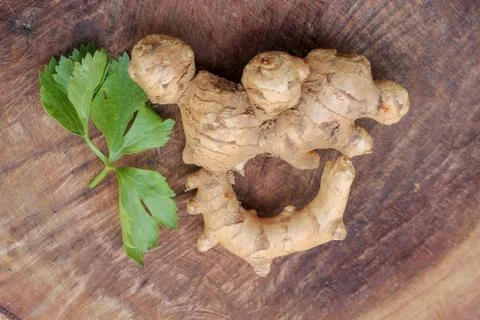 Ginger root  on wooden background Stock Photos