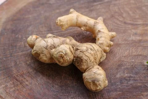 Ginger root  on wooden background Stock Photos