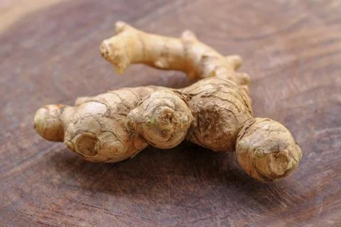 Ginger root  on wooden background Stock Photos