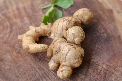 Ginger root  on wooden background Stock Photos