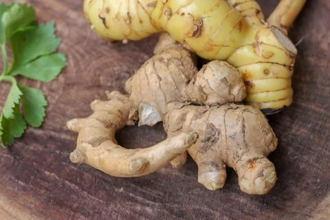 Ginger root  on wooden background Stock Photos