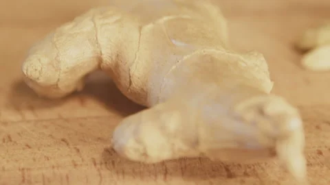 Ginger root on a wooden table. Close up, macro. Studio shot. Interior. Kitchen. Stock Footage 272932358