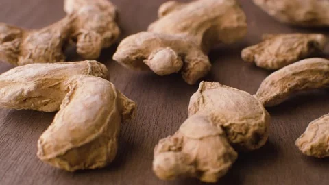 Ginger roots on the wooden table Stock Footage 140010058