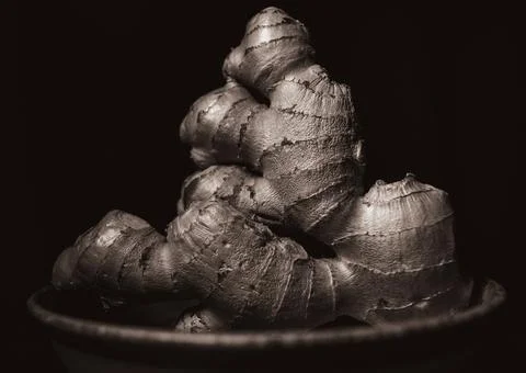 Ginger spice on dark backround Photos