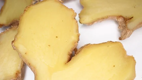 Ginger Spicy Ginger Slices on Rotating Rolling Plate Background Video For Any Stock Footage 127500224