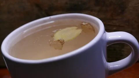 A ginger tea cup on the table. A cup of hot tea Fotos de archivo
