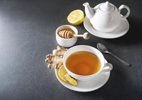 Ginger tea with fresh ginger root and lemon Stock Photos