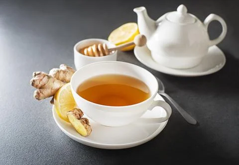 Ginger tea with fresh ginger root and lemon Stock Photos