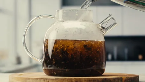 Ginger tea, freshly brewed black organic herbal tea with ginger, mint and lemon Stock Footage 309634022