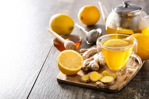 Ginger tea with lemon and honey in crystal glass Stock Photos
