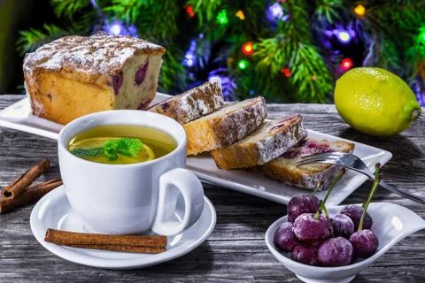 Ginger tea with lemon and mint and cherry cake Stock Photos