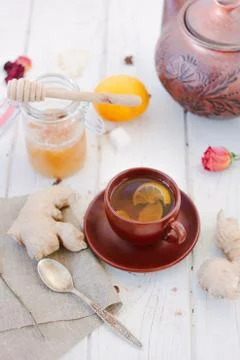 Ginger tea with lemon, lime and honey on white. Stock-Fotos