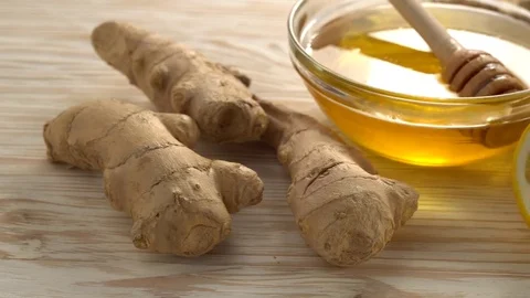 Ginger tea with lemon, mint and honey on wooden background. Stock Footage 75748332