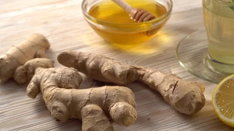 Ginger tea with lemon, mint and honey on wooden background. Stock Footage 75775028