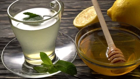 Ginger tea with lemon, mint and honey on wooden background. Stock Footage 75904556