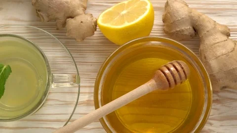 Ginger tea with lemon, mint and honey on wooden background. Stock Footage 76644924
