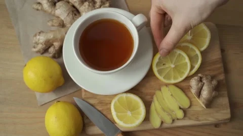 Ginger tea with lemon on a wooden table Stock Footage 148464010