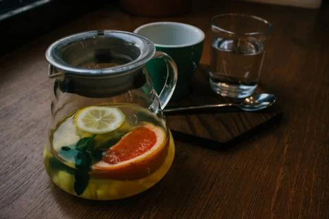 Ginger tea with mint and lemon and grapefruit. Herbal healthy drink in the te Stock Photos