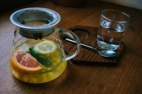 Ginger tea with mint and lemon and grapefruit. Herbal healthy drink in the te Stock Photos