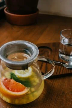 Ginger tea with mint and lemon and grapefruit. Herbal healthy drink in the te Stock Photos