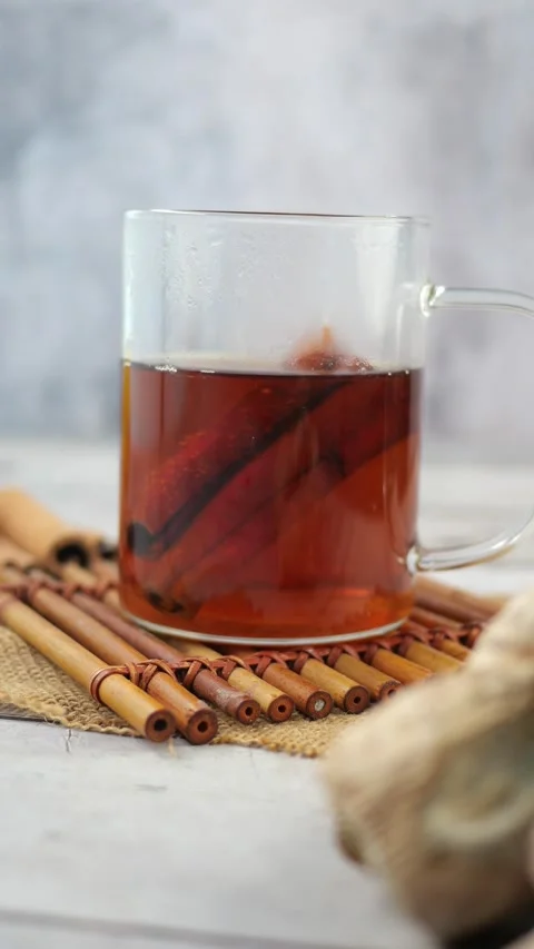Ginger tea preparation with cinnamon and herbs Stock Footage 326576374