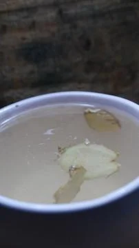 A ginger tea on the table. A cup of hot tea. A large cup of ginger tea Fotos de archivo