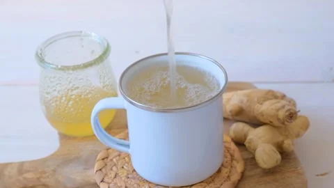 Ginger tea in a white mug Stock Footage 287009312