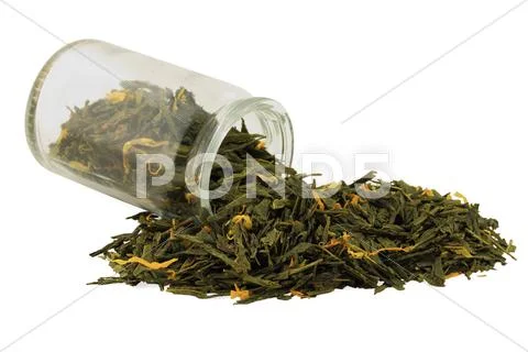 Ginger, turmeric, green tea spilled on pile. Stock Photos