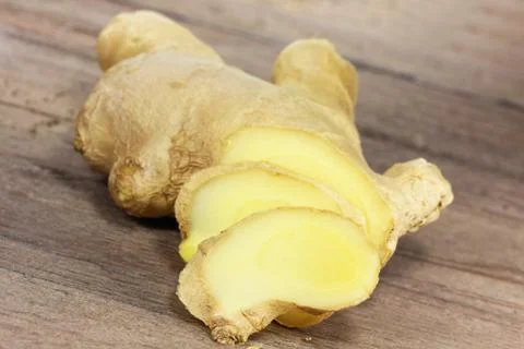 Ginger on wooden table Stock Photos