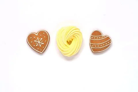 Gingerbread and bize, multi-colored sweets, airy cakes on isolated white back Stock Photos