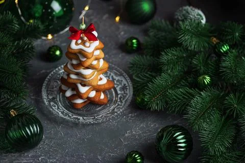Gingerbread Christmas tree cookie stack with festive green ornaments 스톡 사진