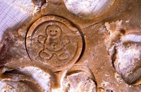 Gingerbread cookie cut from raw dough Stock Photos