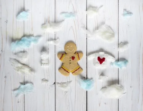 Gingerbread cookie men among the clouds, on the white background Stock Photos
