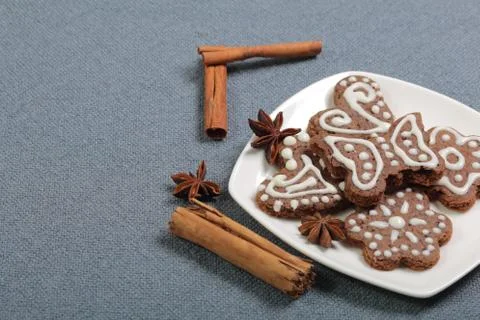 Gingerbread cookies decorated with a pattern of white glaze. On a background  Stock Photos