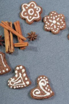 Gingerbread cookies decorated with a pattern of white glaze. On a background  Stock Photos