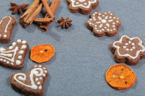 Gingerbread cookies decorated with a pattern of white glaze. On a background  Stock Photos