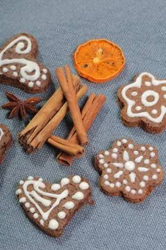 Gingerbread cookies decorated with a pattern of white glaze. On a background  Stock Photos