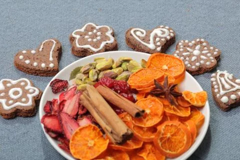 Gingerbread cookies decorated with a pattern of white glaze. On a background  Stock Photos
