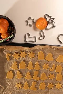 Gingerbread Cookies Dough Cut on Baking Sheet for Christmas Eve Stock Photos