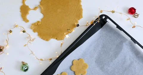 Gingerbread cookies on the table. Process of preparing cookies in kitchen 库存照片