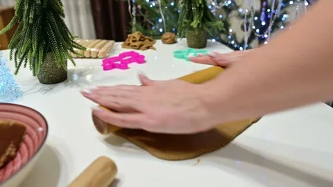 Gingerbread dough preparation by beautiful hands under festive lights Stock Footage 344821679