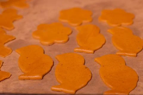 Gingerbread dough on the table with gingerbread figures. Stock Photos