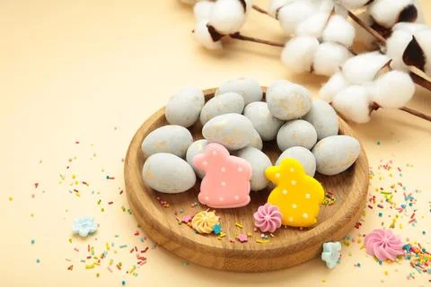 Gingerbread Easter figures - rabbit with easter egg on beige background. Happ Stock Photos