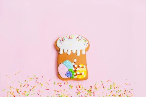 Gingerbread in the form of a easter cake and and sweet color sprinkles on pink Stock Photos